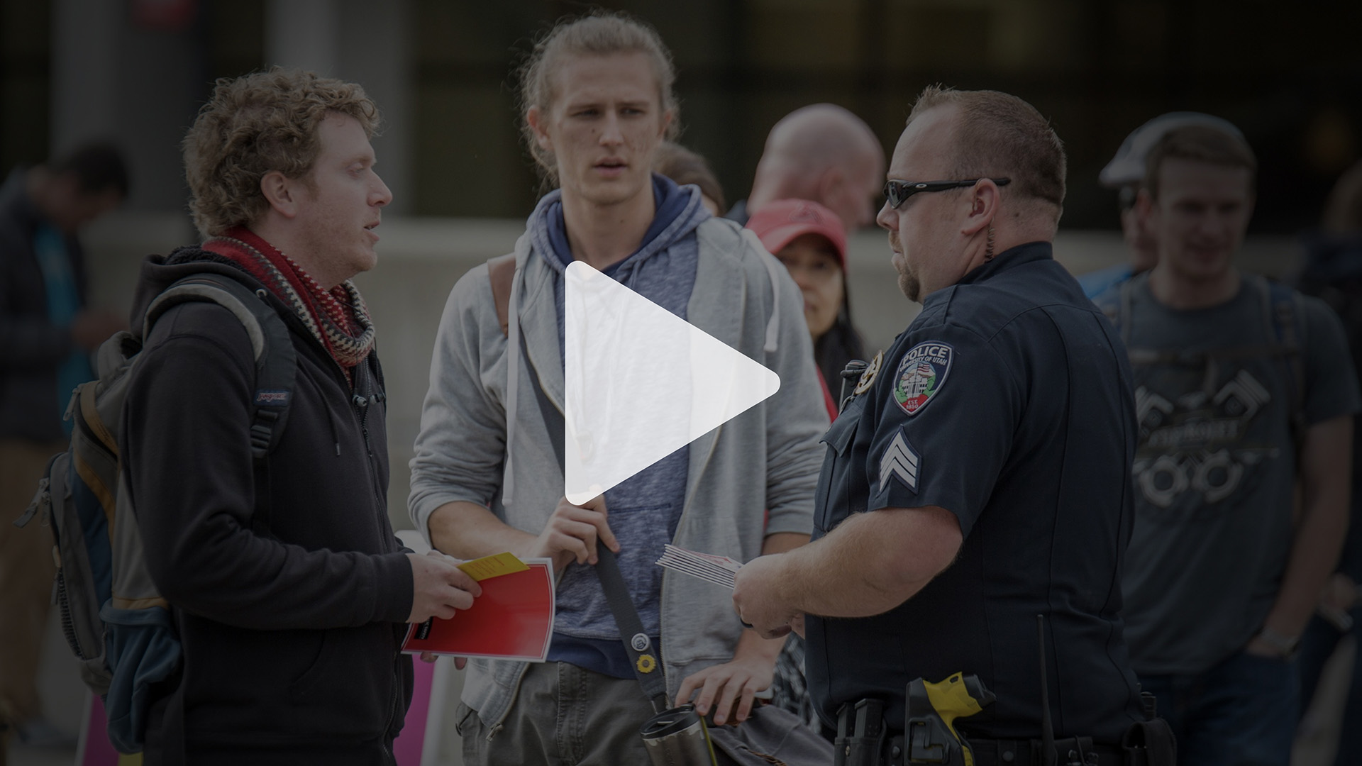 Video thumbnail showing police officers interacting with community members